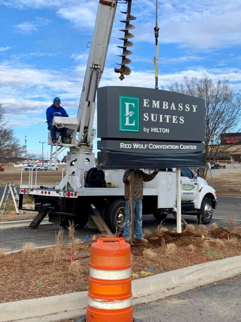 installation of embassy suites by hilton hotel commercial sign
