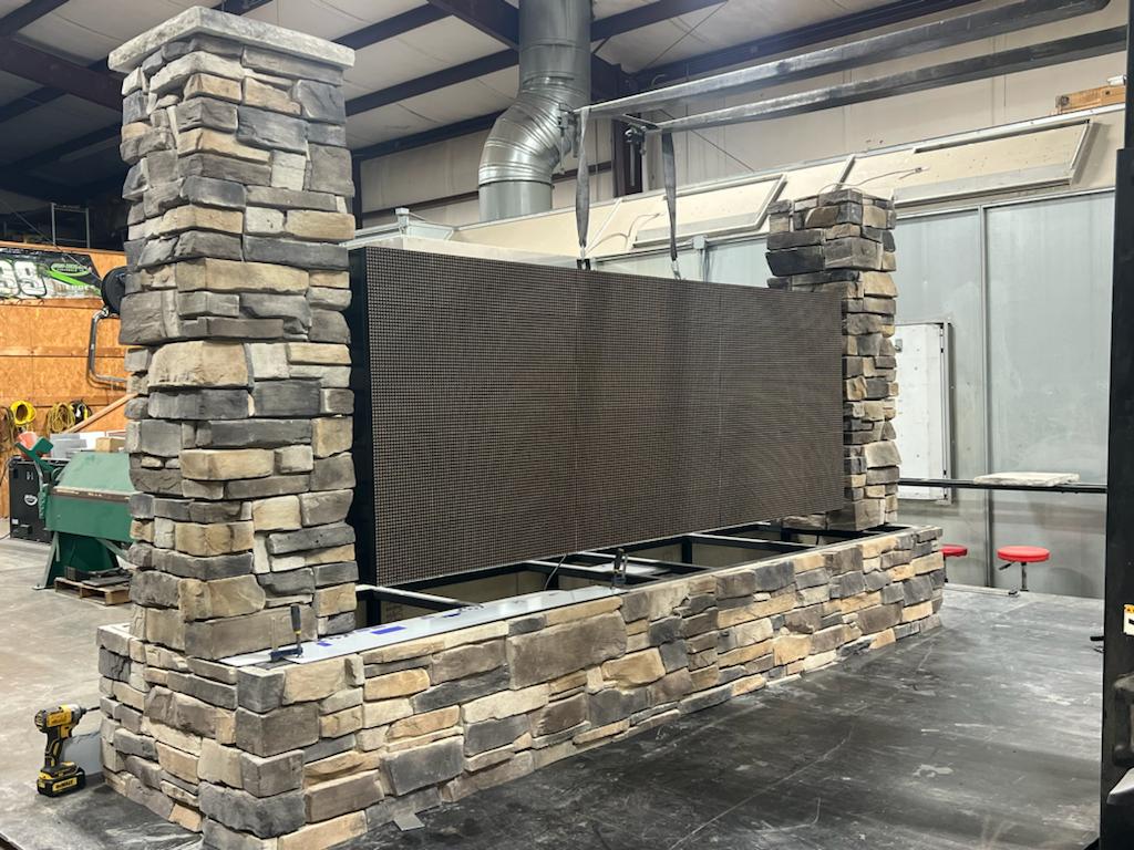 digital sign with stone surrounding